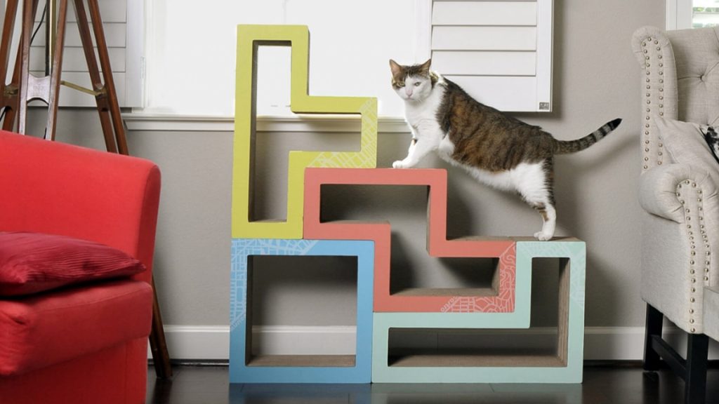 A cat is standing on the Katris Modular Cat Tree.